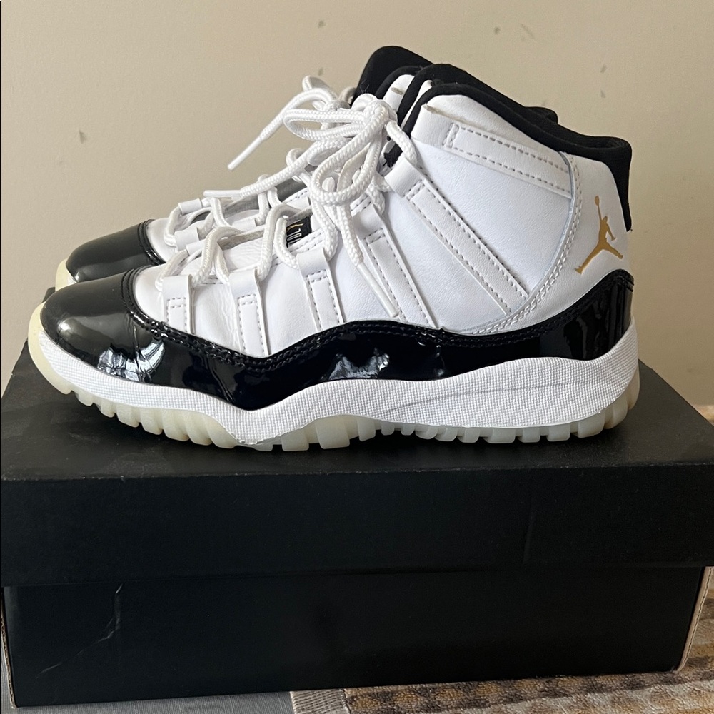 Jordan 11 Retro Kids White and Black Sneakers with Gold Accents Size 2Y